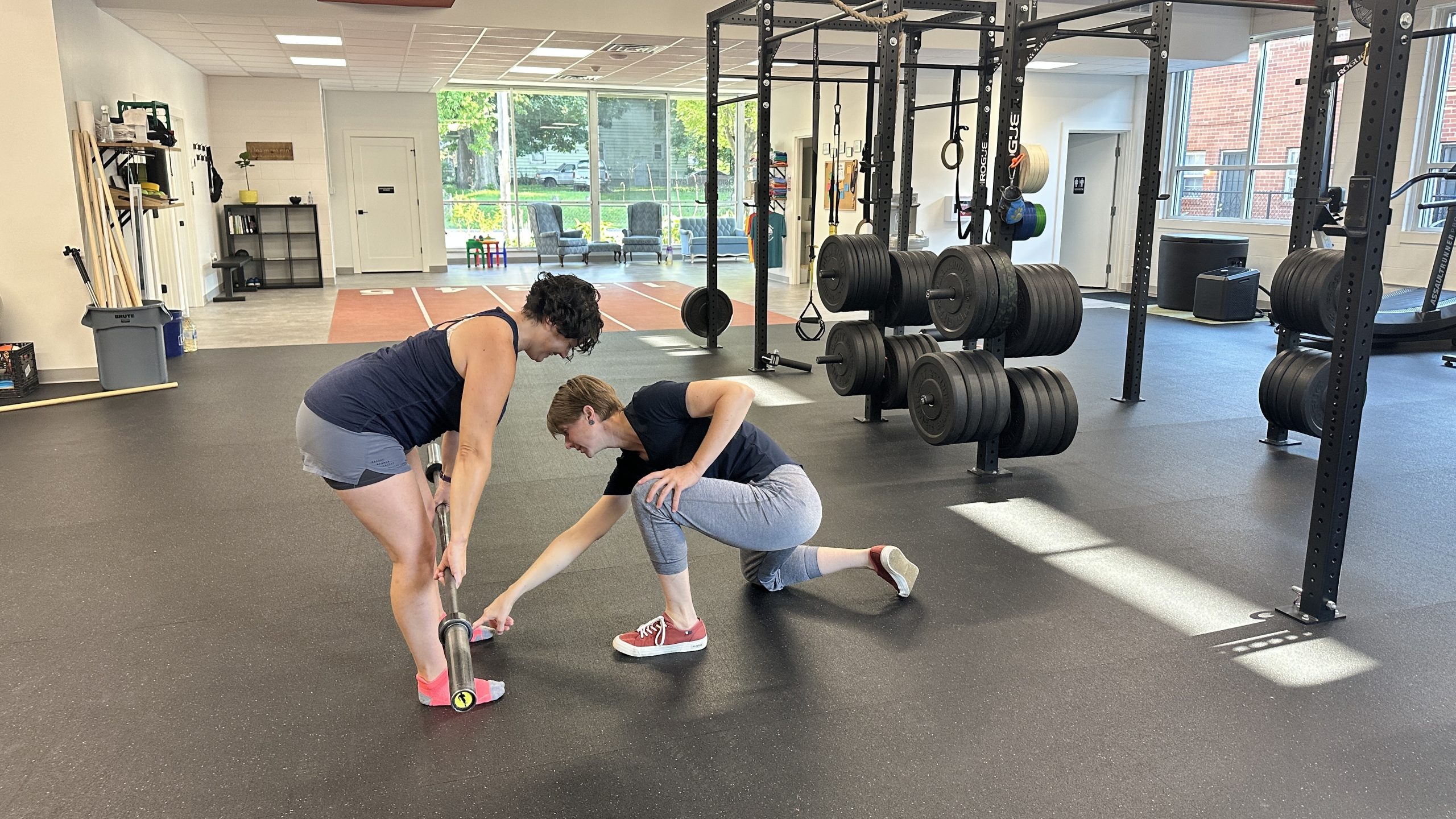 Physical therapist working with a client in the TPS performance gym