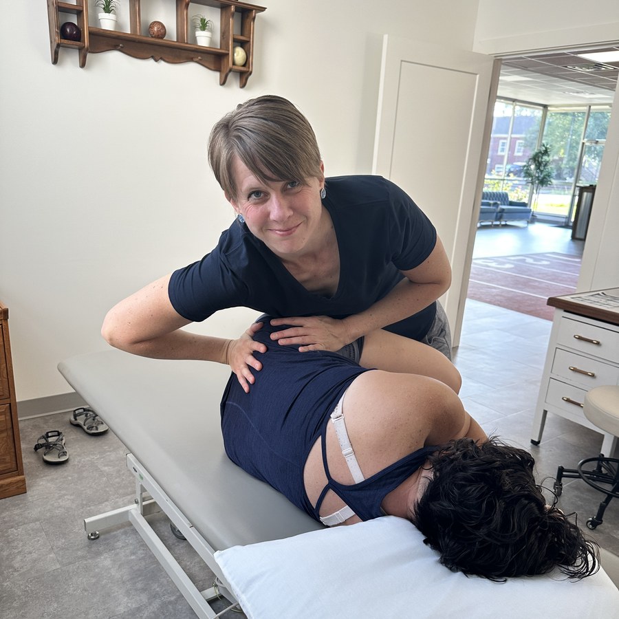 A Perfect Squat physical therapist helping a client