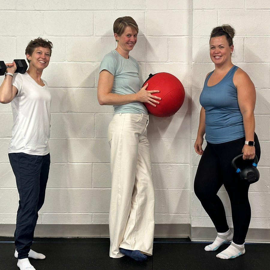 The Perfect Squat team training with a dumbbell, medicine ball and kettlebell